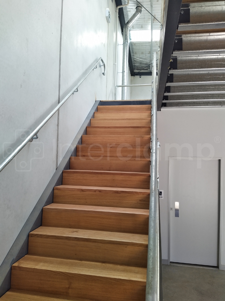 Interclamp DDA Assist modular 5000 series constructed on a mezzanine floor staircase